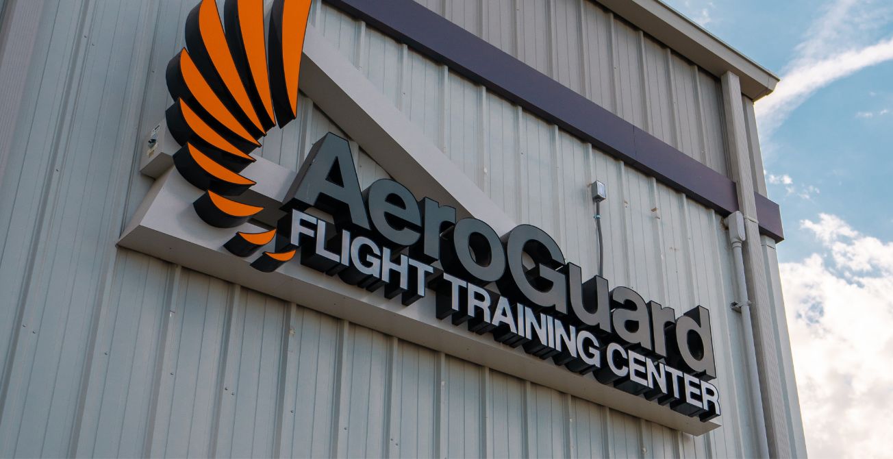 AeroGuard Flight Training Center logo on building