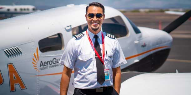 Certified Flight Instructor standing near AeroGuard Piper Archer plane